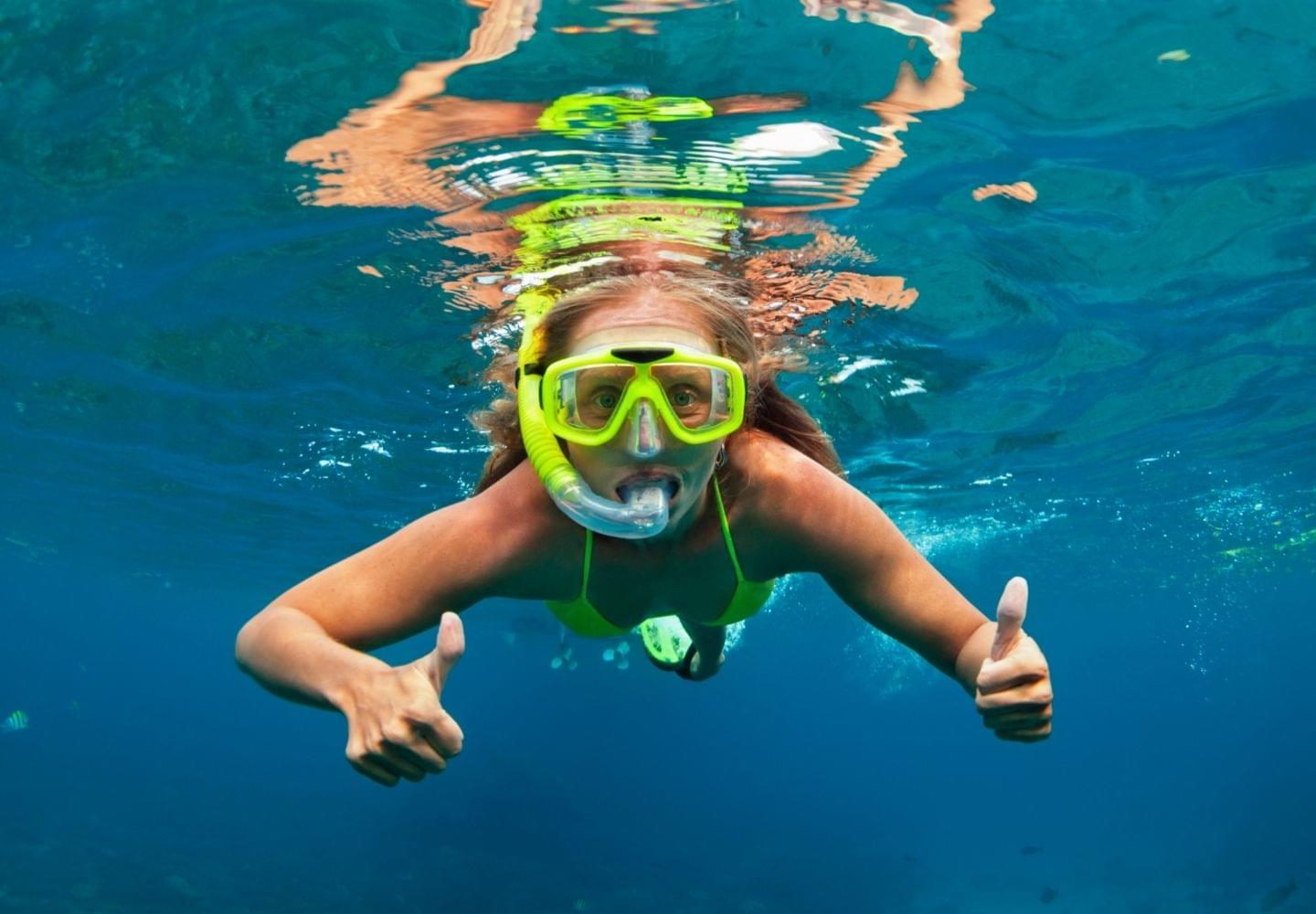 girl snorkeling underwater