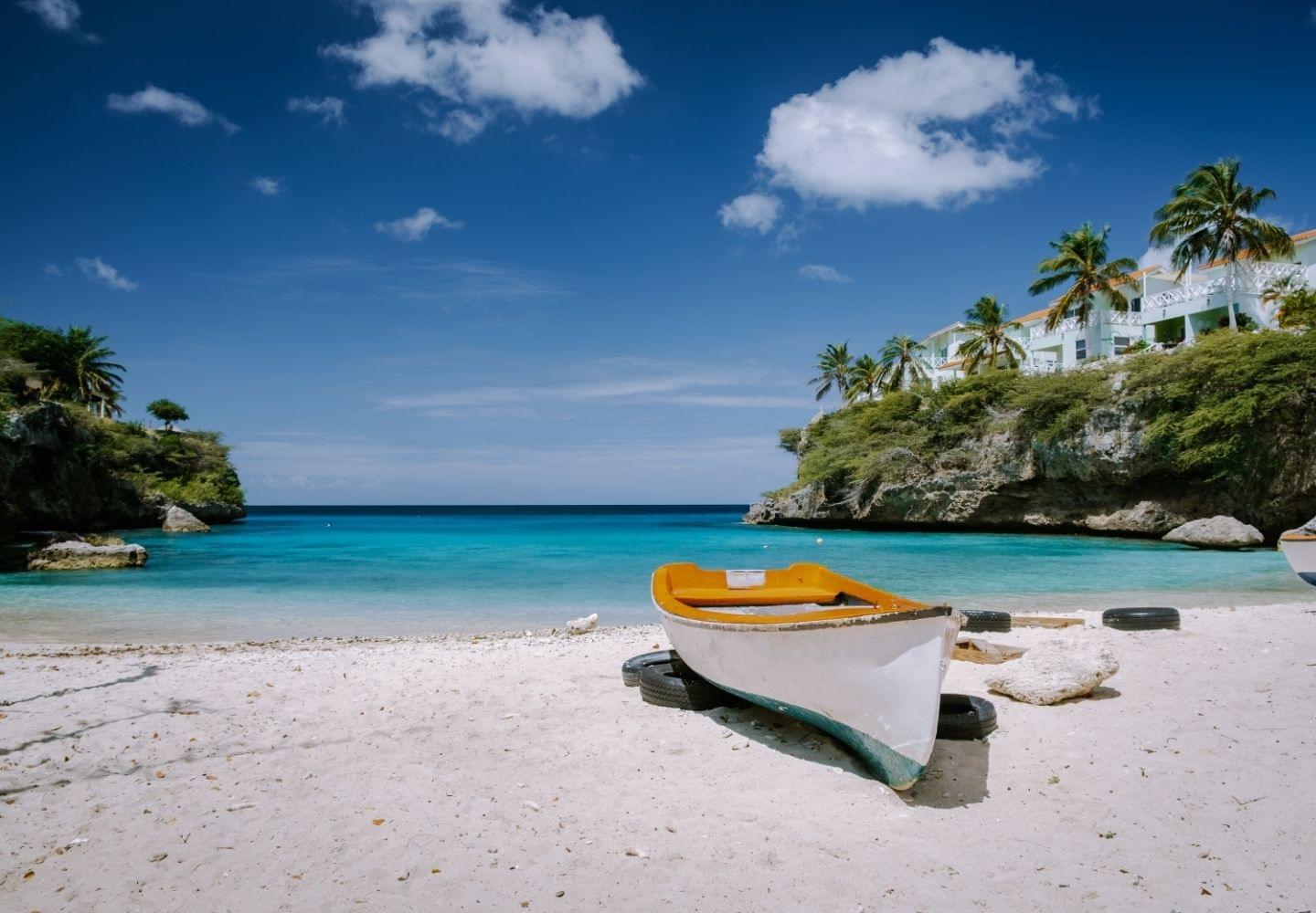 small boat on sand at playa lagun