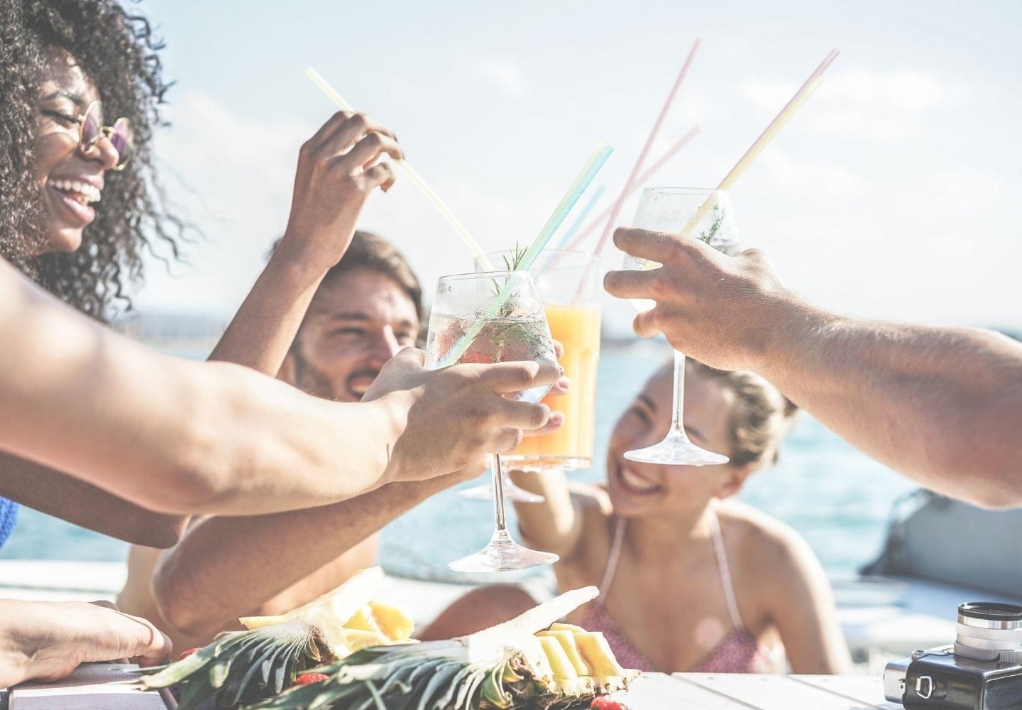 friends on boat with drinks