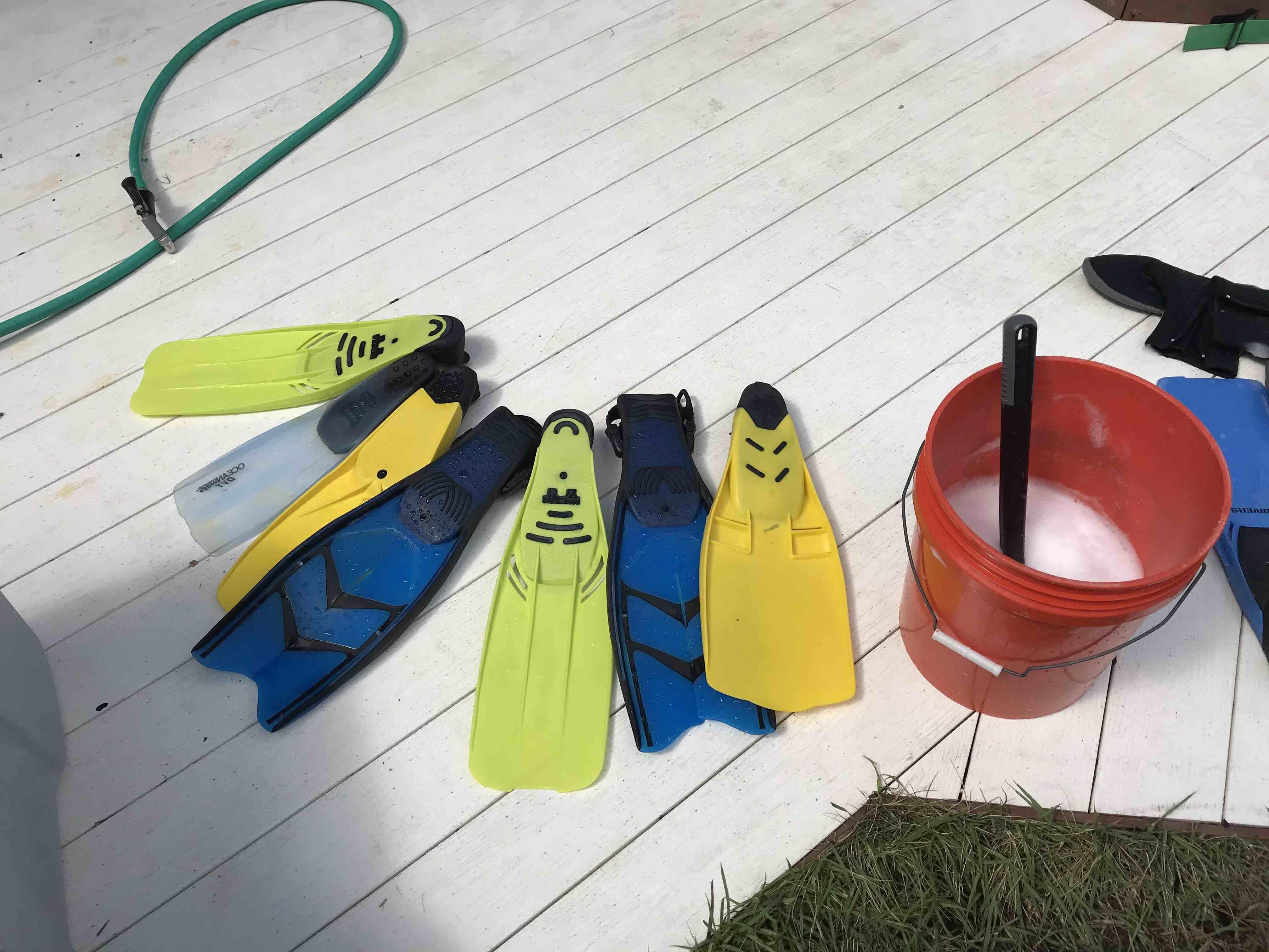 rinsing snorkel fins with fresh water
