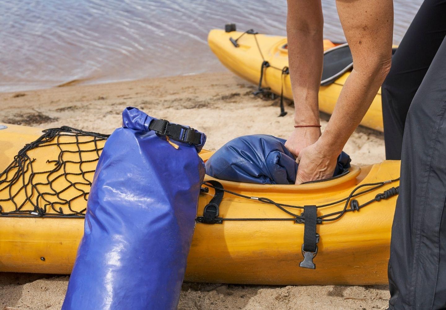 waterproof bag stuffed in kayak storage