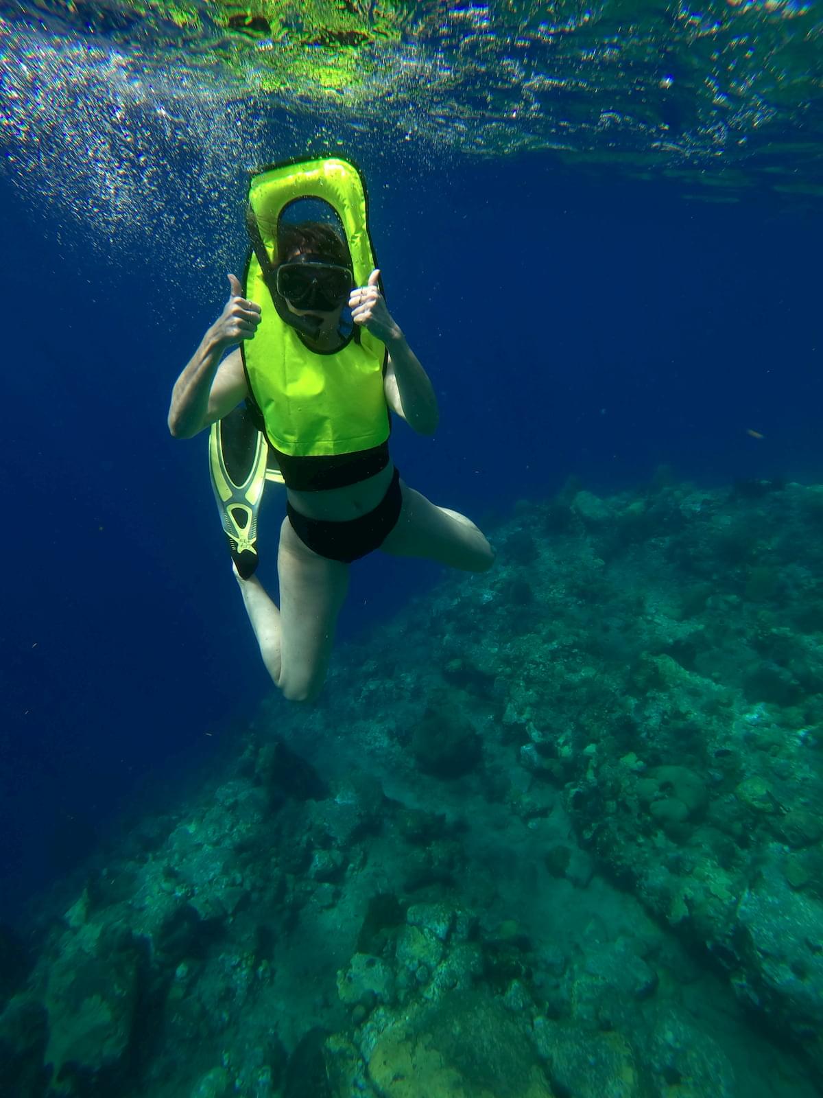 underwater with snorkel vest on